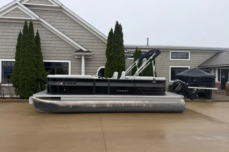 The Image of 2019 Crest II SLC LTD pontoon boat parked outside a building. - 1