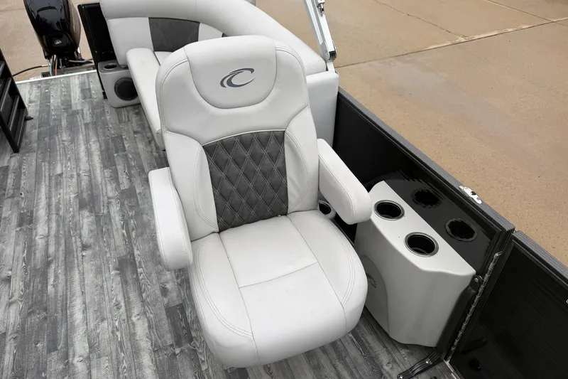 Slide: The Image of Luxurious seating on 2019 Crest II SLC LTD boat with cup holders and stylish flooring. - 11