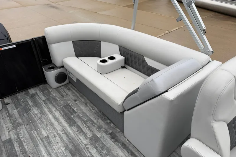 Slide: The Image of Luxurious seating on 2019 Crest II SLC LTD pontoon boat with cup holders and stylish flooring. - 13