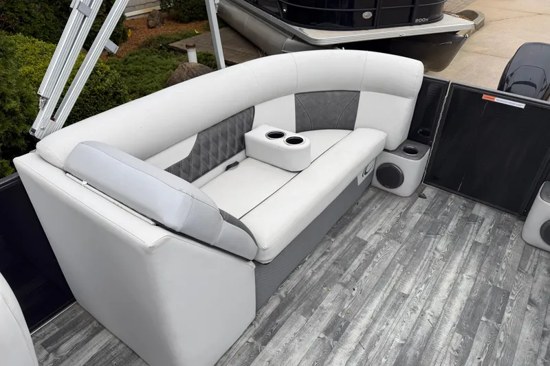 Slide: The Image of Luxurious seating on 2019 Crest II SLC LTD pontoon boat with cup holders and stylish flooring. - 14