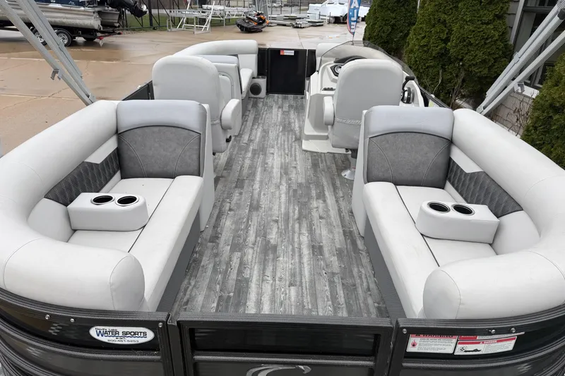 Slide: The Image of 2019 Crest II SLC LTD pontoon boat interior with gray seating and wood-style flooring. - 15