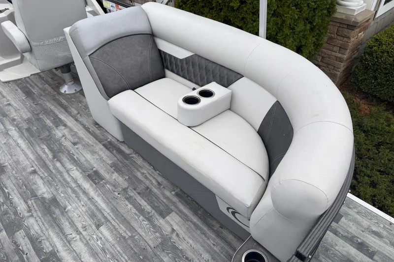 Slide: The Image of Luxurious seating on 2019 Crest II SLC LTD pontoon boat with cup holders and stylish design. - 16