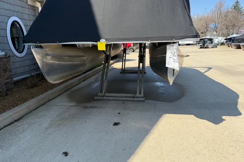 Slide: The Image of 2019 Crest II SLC LTD pontoon boat on a lift, covered and parked outdoors. - 20