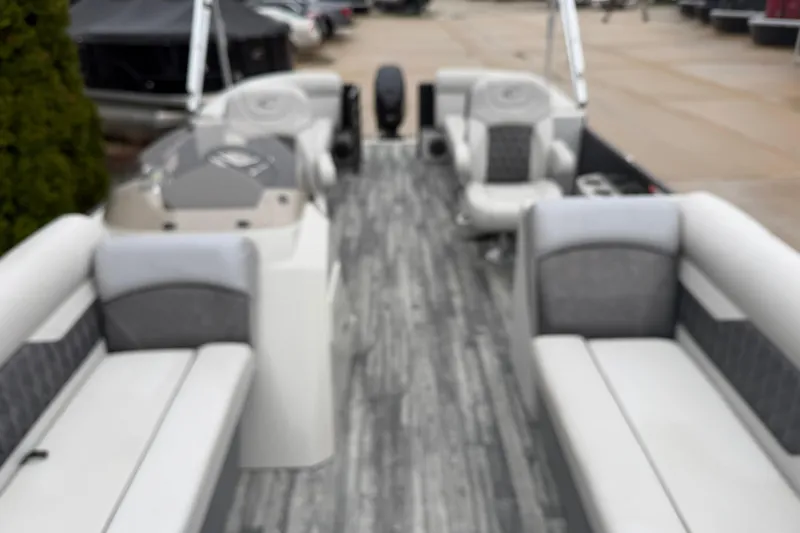 Slide: The Image of 2019 Crest II SLC LTD pontoon boat interior with gray seating and modern design. - 4