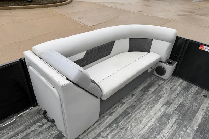 Slide: The Image of 2019 Crest II SLC LTD boat interior with gray and white seating on wood-patterned flooring. - 8