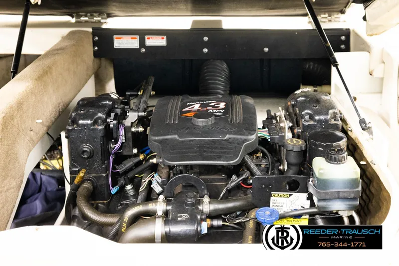 Slide: The Image of Engine compartment of a 2003 Sea Ray 200 Bow Rider boat, featuring a MerCruiser 4.3L engine. - 22