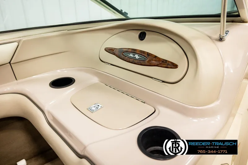 Slide: The Image of Interior of 2003 Sea Ray 200 Bow Rider boat with cup holders and storage compartment. - 28