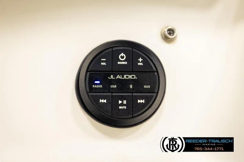 Slide: The Image of JL Audio control panel on a 2003 Sea Ray 200 Bow Rider boat dashboard. - 53