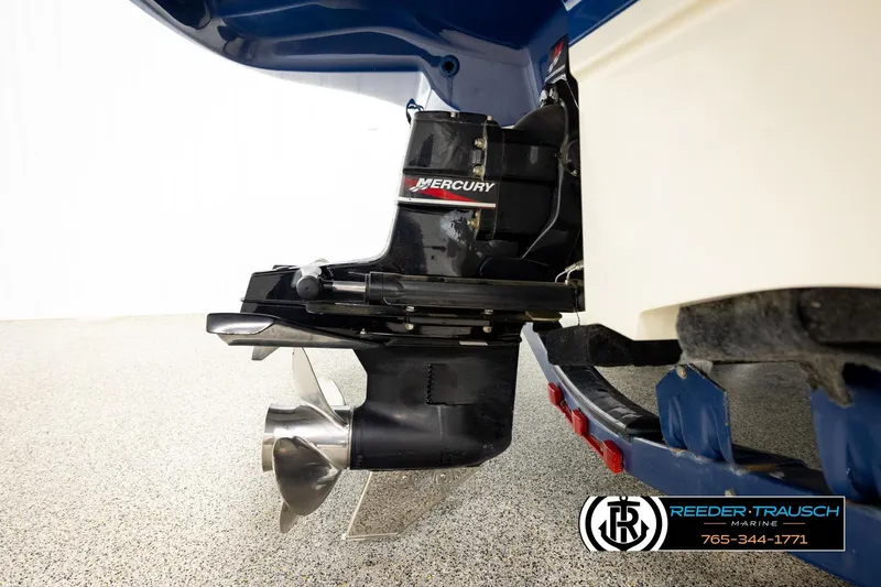 Slide: The Image of 2003 Sea Ray 200 Bow Rider with Mercury outboard motor, displayed on a trailer. - 54