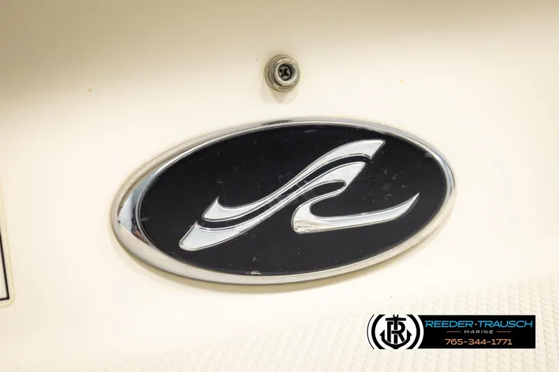 Slide: The Image of 2003 Sea Ray 200 Bow Rider logo emblem on boat exterior. - 61
