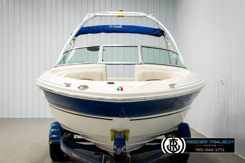 Slide: The Image of 2003 Sea Ray 200 Bow Rider boat on trailer in indoor storage. - 7