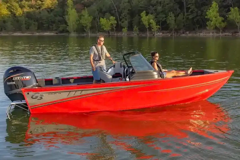 Slide: The Image of Manufacturer Provided Image: 2026 G3 Angler V18 FS boat on a lake, featuring a vibrant red design. - 12