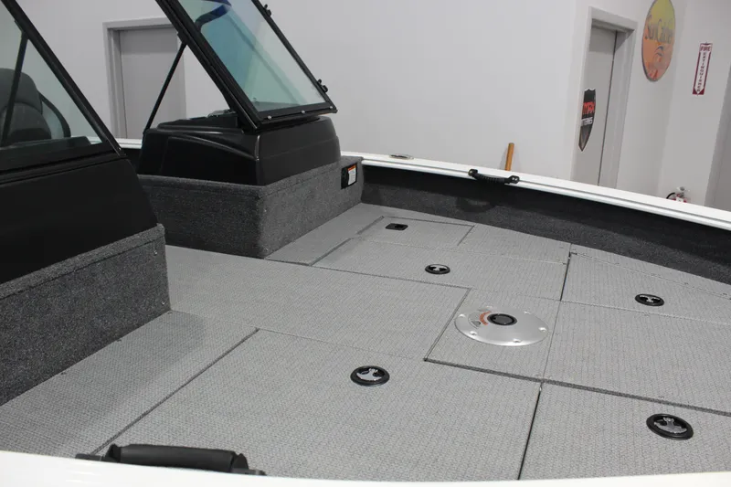 Slide: The Image of 2026 G3 Angler V18 FS boat interior with spacious deck and storage compartments. - 2