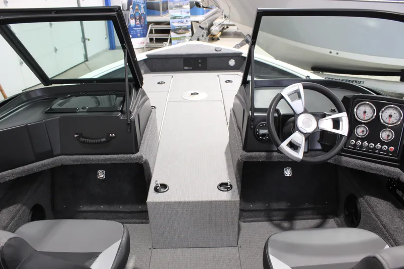 Slide: The Image of 2026 G3 Angler V18 FS boat interior with steering wheel and dashboard controls. - 4