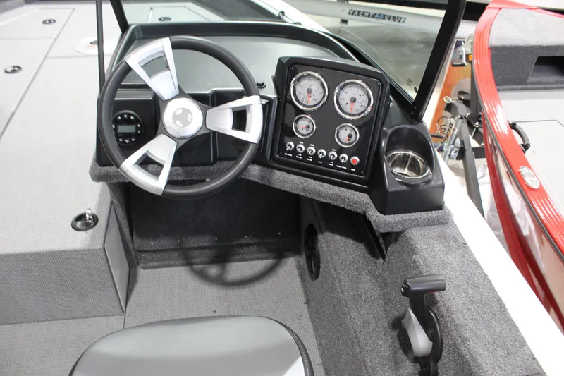 Slide: The Image of 2026 G3 Angler V18 FS boat dashboard with steering wheel and instrument panel. - 5