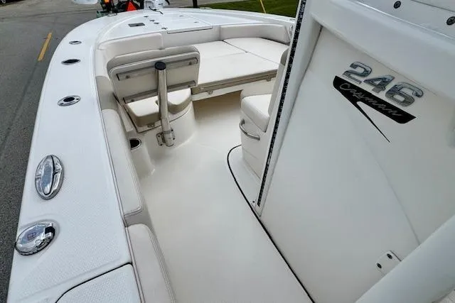 Slide: The Image of 2017 Robalo 246 Cayman boat interior with seating and storage compartments. - 12