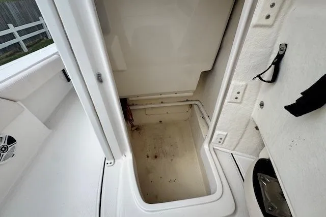 Slide: The Image of Storage compartment on a 2017 Robalo 246 Cayman boat, showcasing interior space. - 15