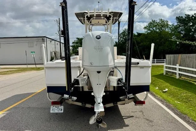 Slide: The Image of 2017 Robalo 246 Cayman boat with Yamaha engine on a road. - 3