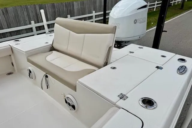 Slide: The Image of 2017 Robalo 246 Cayman boat interior with seating and Yamaha outboard motor. - 7