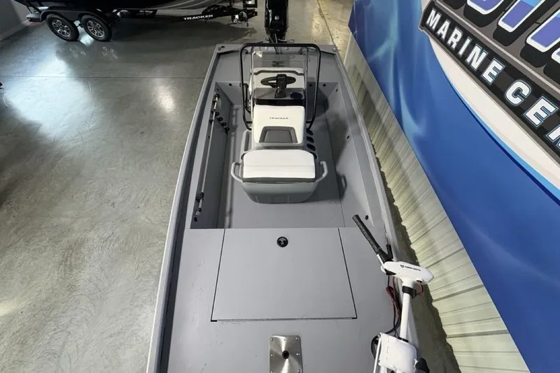 Slide: The Image of 2026 Tracker Bass Tracker Classic CC boat in showroom, featuring sleek design and modern equipment. - 23