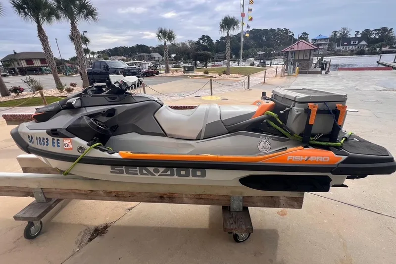 The Image of 2022 Sea-Doo FishPro Sport 170 jet ski on a dock, ready for fishing adventure. - 0