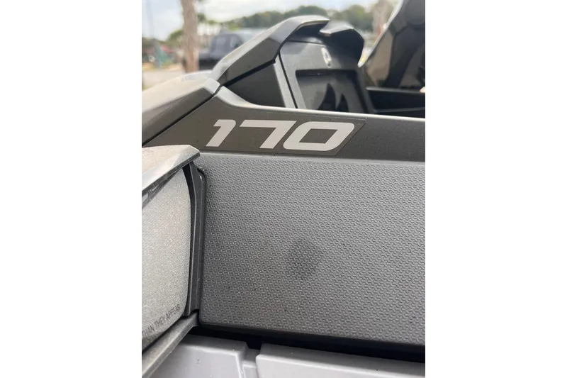 Slide: The Image of Close-up of 2022 Sea-Doo FishPro Sport 170, showcasing model number "170" on textured surface. - 14