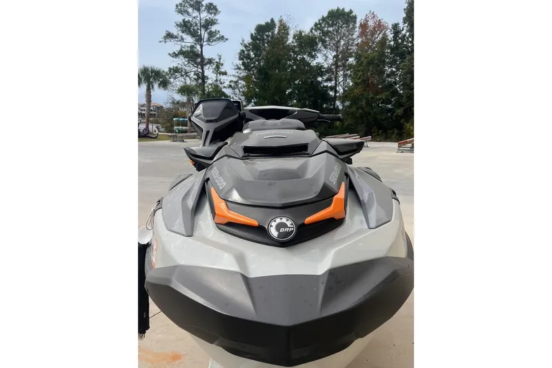 Slide: The Image of 2022 Sea-Doo FishPro Sport 170 jet ski, front view, parked outdoors. - 2