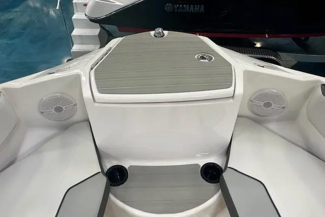 Slide: The Image of 2025 Yamaha Boats AR220 interior with speakers and sleek design. - 11