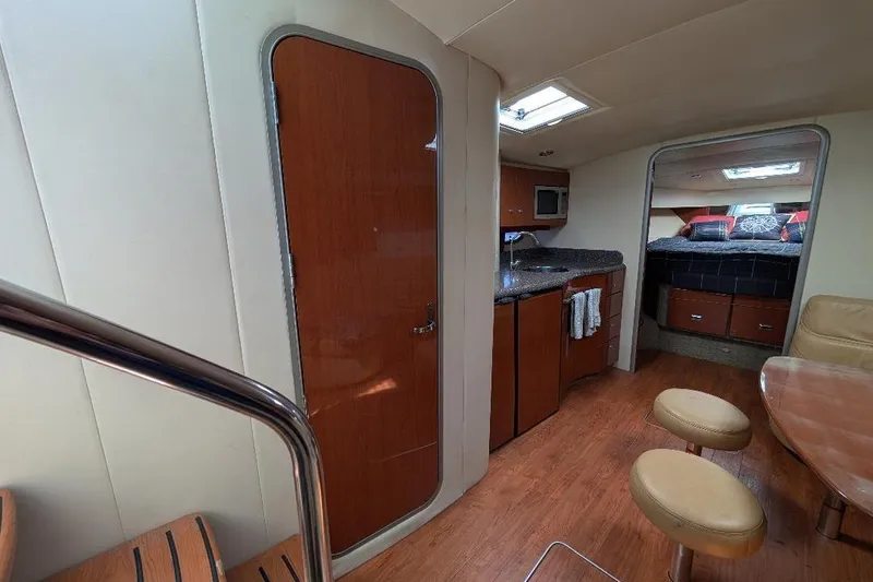 Slide: The Image of Interior of 2008 Formula 40 Performance Cruiser with kitchen, seating, and bedroom area. - 19