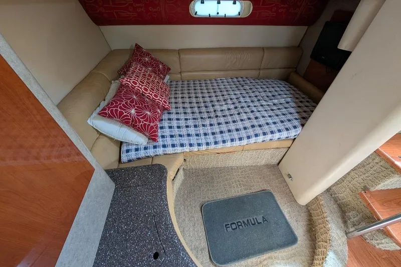 Slide: The Image of Cozy interior of a 2008 Formula 40 Performance Cruiser with a comfortable bed and stylish decor. - 26