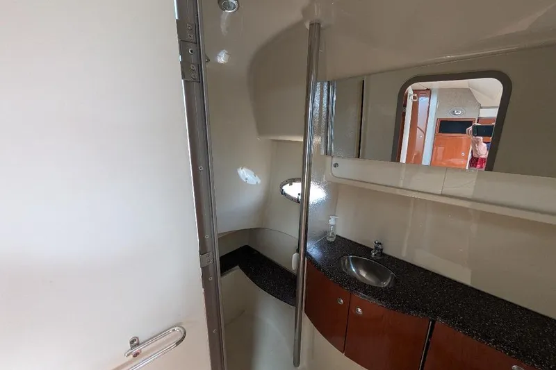 Slide: The Image of 2008 Formula 40 Performance Cruiser bathroom with sink, mirror, and storage cabinets. - 28