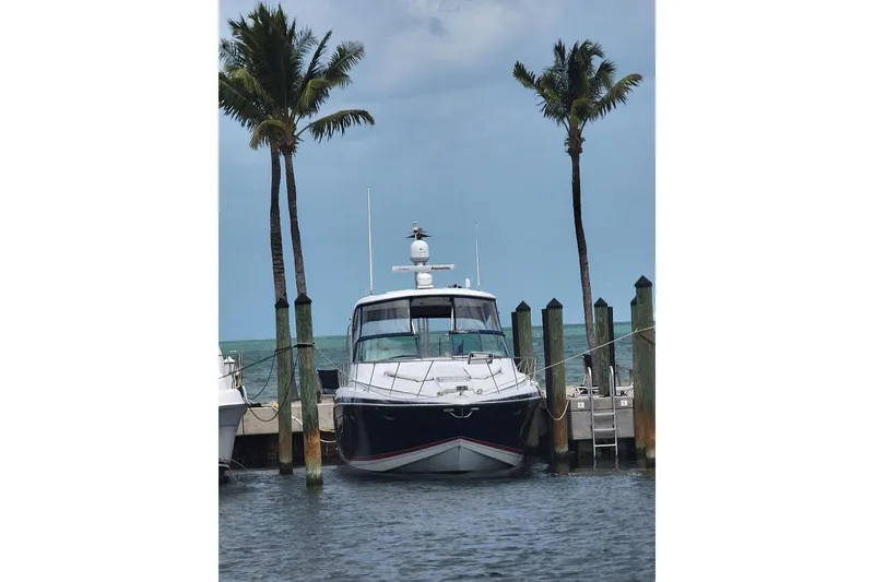 Slide: The Image of 2008 Formula 40 Performance Cruiser docked at marina with city skyline backdrop. - 3