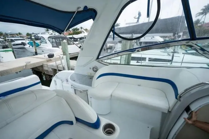 Slide: The Image of 2008 Formula 40 Performance Cruiser docked at a marina, surrounded by other boats. - 9