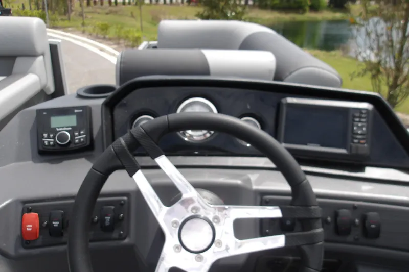 Slide: The Image of Steering console of 2026 Bennington 16 S L-Bench boat with modern controls and dashboard. - 10