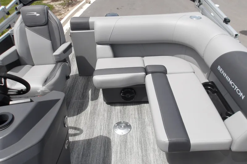 Slide: The Image of 2026 Bennington 16 S L-Bench boat interior with gray seating and steering console. - 11