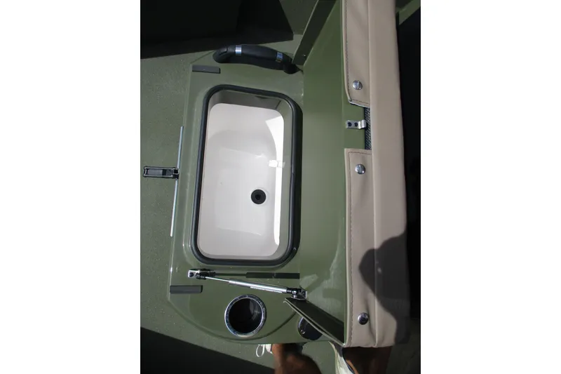 Slide: The Image of Interior view of 2026 Vexus Defender 201 boat, featuring a built-in storage compartment. - 11