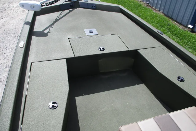 Slide: The Image of 2026 Vexus Defender 201 boat deck with storage compartments and seating area. - 3