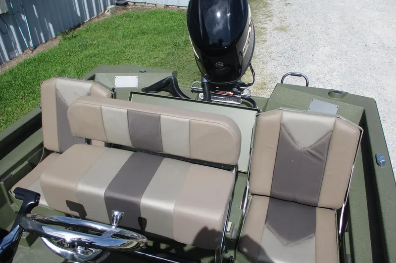 Slide: The Image of 2026 Vexus Defender 201 boat interior with beige and brown seating. - 7