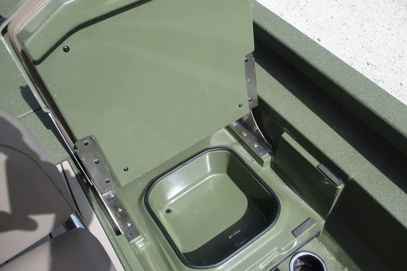 Slide: The Image of Open storage compartment in 2026 Vexus Defender 201 boat, featuring green interior design. - 9