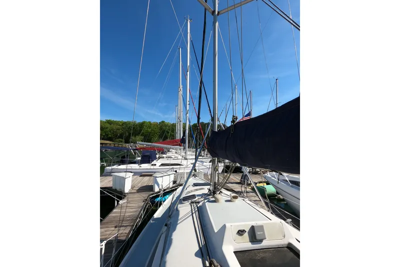Slide: The Image of Sailboat docked at marina, Hunter 326 model, 2003, with clear blue sky. - 24