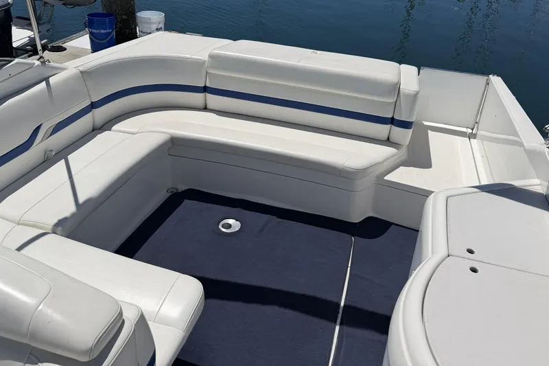 Slide: The Image of 2001 Formula 330 Sun Sport boat interior with white and blue seating. - 4