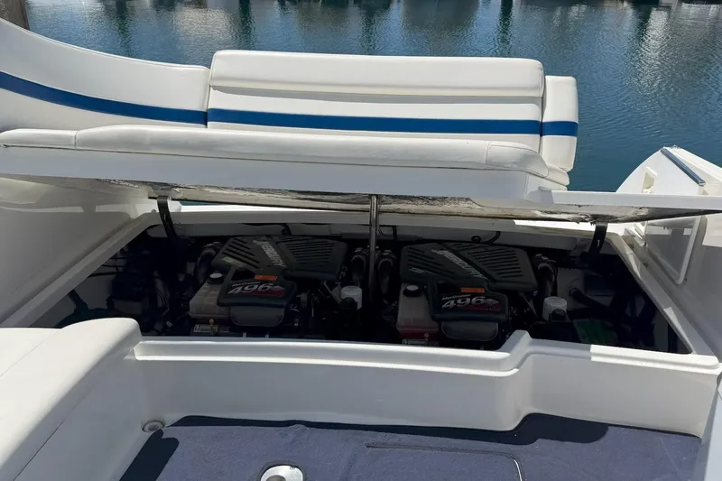 Slide: The Image of 2001 Formula 330 Sun Sport boat engine compartment with twin MerCruiser 496 engines. - 5