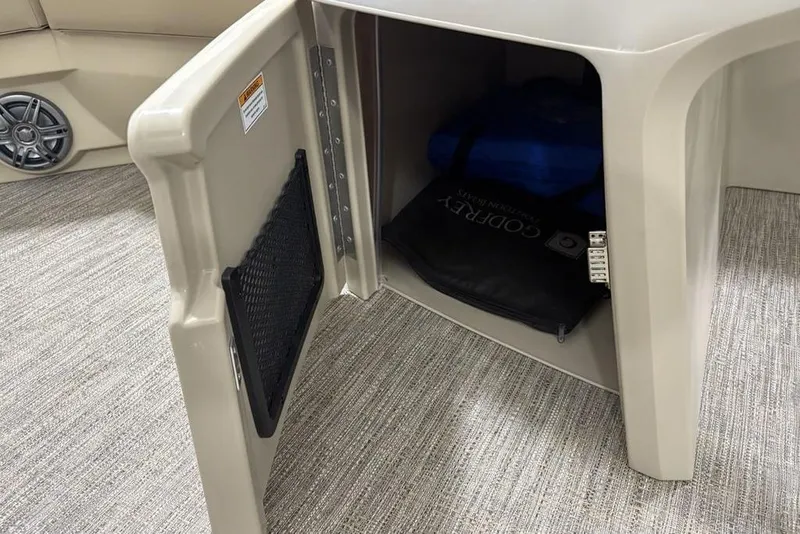 Slide: The Image of Open storage compartment on Godfrey Xperience 2086 SBX boat, showcasing interior space and accessories. - 15