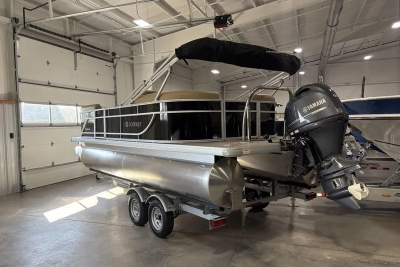 Slide: The Image of 2026 Godfrey Xperience 2086 SBX pontoon boat with Yamaha motor in a garage. - 3
