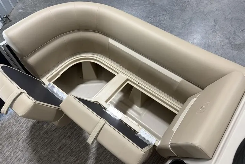 Slide: The Image of 2026 Godfrey Xperience 2086 SBX boat seating with storage compartments open. - 4