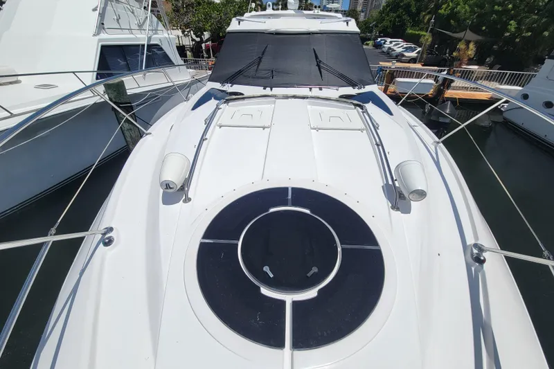 Slide: The Image of 2012 Four Winns V435 yacht deck with circular hatch and sleek design. - 41