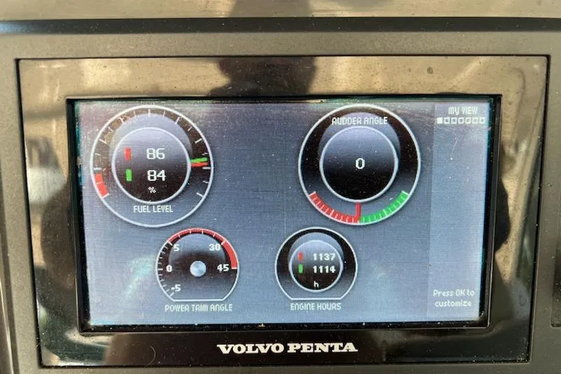 Slide: The Image of Volvo Penta dashboard display on 2012 Four Winns V435 boat, showing fuel, rudder, and engine data. - 44
