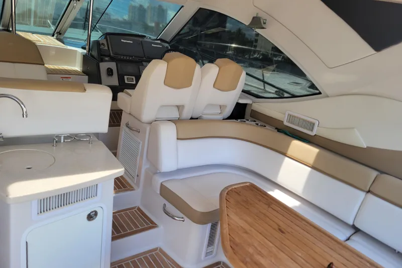 Slide: The Image of Luxurious interior of 2012 Four Winns V435 yacht with seating and kitchenette. - 53