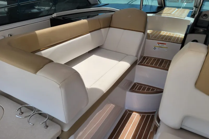 Slide: The Image of Luxurious seating area on 2012 Four Winns V435 yacht with elegant wood-accented steps. - 55