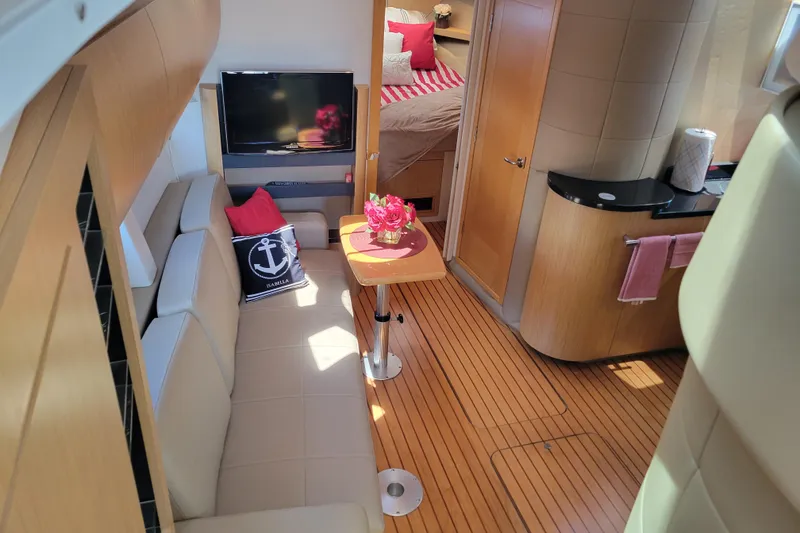 Slide: The Image of Luxurious interior of 2012 Four Winns V435 yacht with cozy seating and modern amenities. - 58